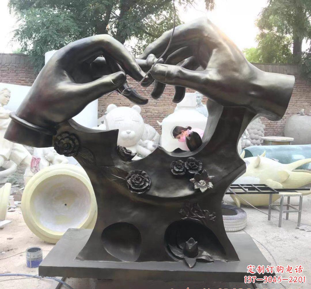 菏泽戴戒指景观铜雕