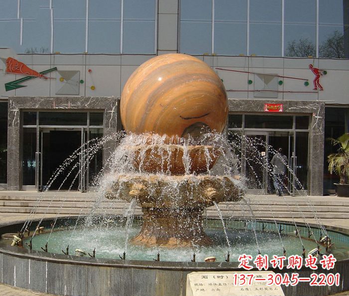 菏泽石来运转球晚霞红风水球石雕