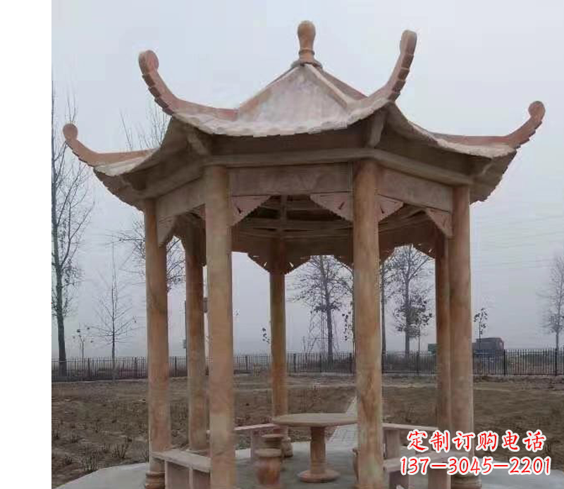菏泽公园晚霞红八角石雕凉亭